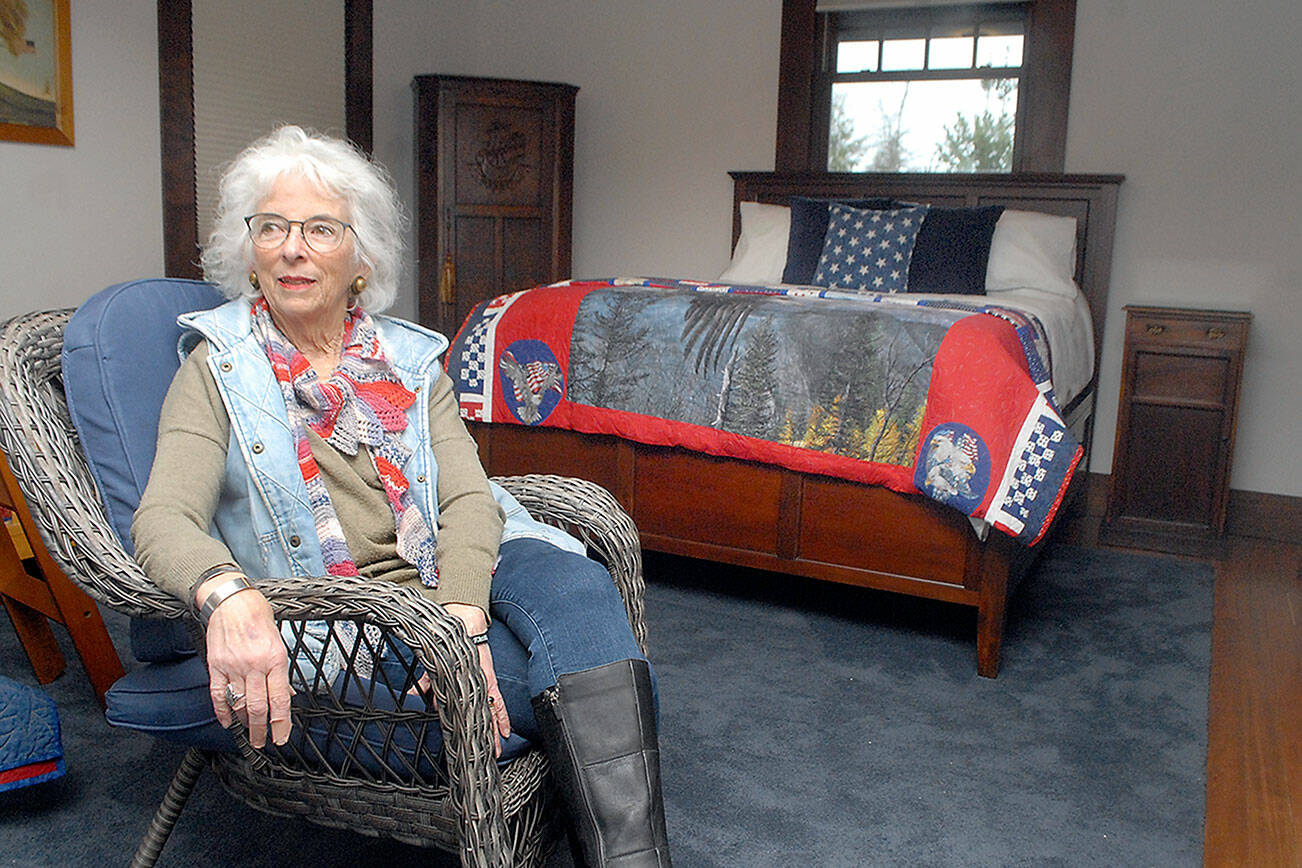 Gold Star mother Betsy Reed Schultz, executive director of the Captain Joseph House in Port Angeles, sits in a bedroom of the soon-to-open respite facility for military families who have lost loved ones in Iraq and Afghanistan. (Keith Thorpe/Peninsula Daily News)