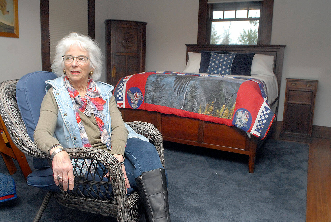 Gold Star mother Betsy Reed Schultz, executive director of the Captain Joseph House in Port Angeles, sits in a bedroom of the soon-to-open respite facility for military families who have lost loved ones in Iraq and Afghanistan. (Keith Thorpe/Peninsula Daily News)