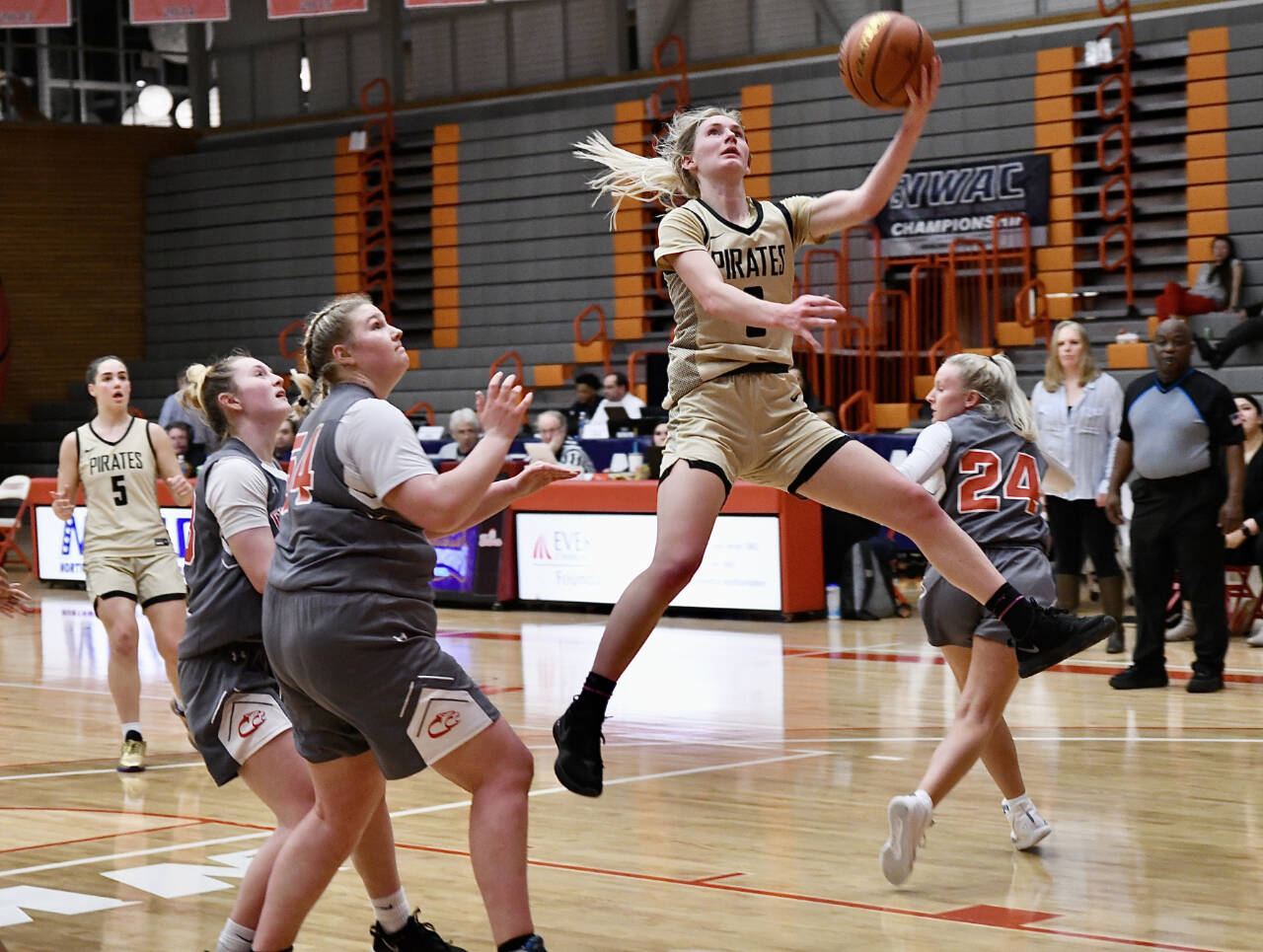Jay Cline/Peninsula College Athletics
Peninsula College's Millie Long goes up for a layup and teammate Hope Glasser watches in the background. Long scored 14 points in the fourth quarter to lead the Pirates to a 67-61 win over Clackamas in the NWAC tournament semifinals in Everett on Saturday night.