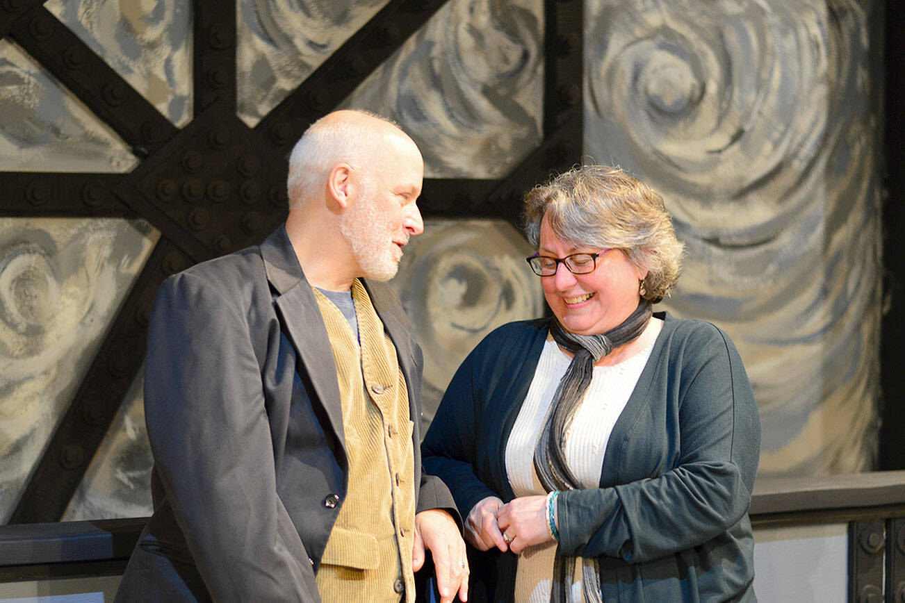 Inside the remodeled playhouse in Port Townsend, "Around the World in Less Than 80 Days" playwright and actor David Natale cracks up Denise Winter, the artistic director of Key City Public Theatre. The two, along with the cast and crew, have just opened ticket sales for the show's world premiere. Diane Urbani de la Paz/Peninsula Daily News