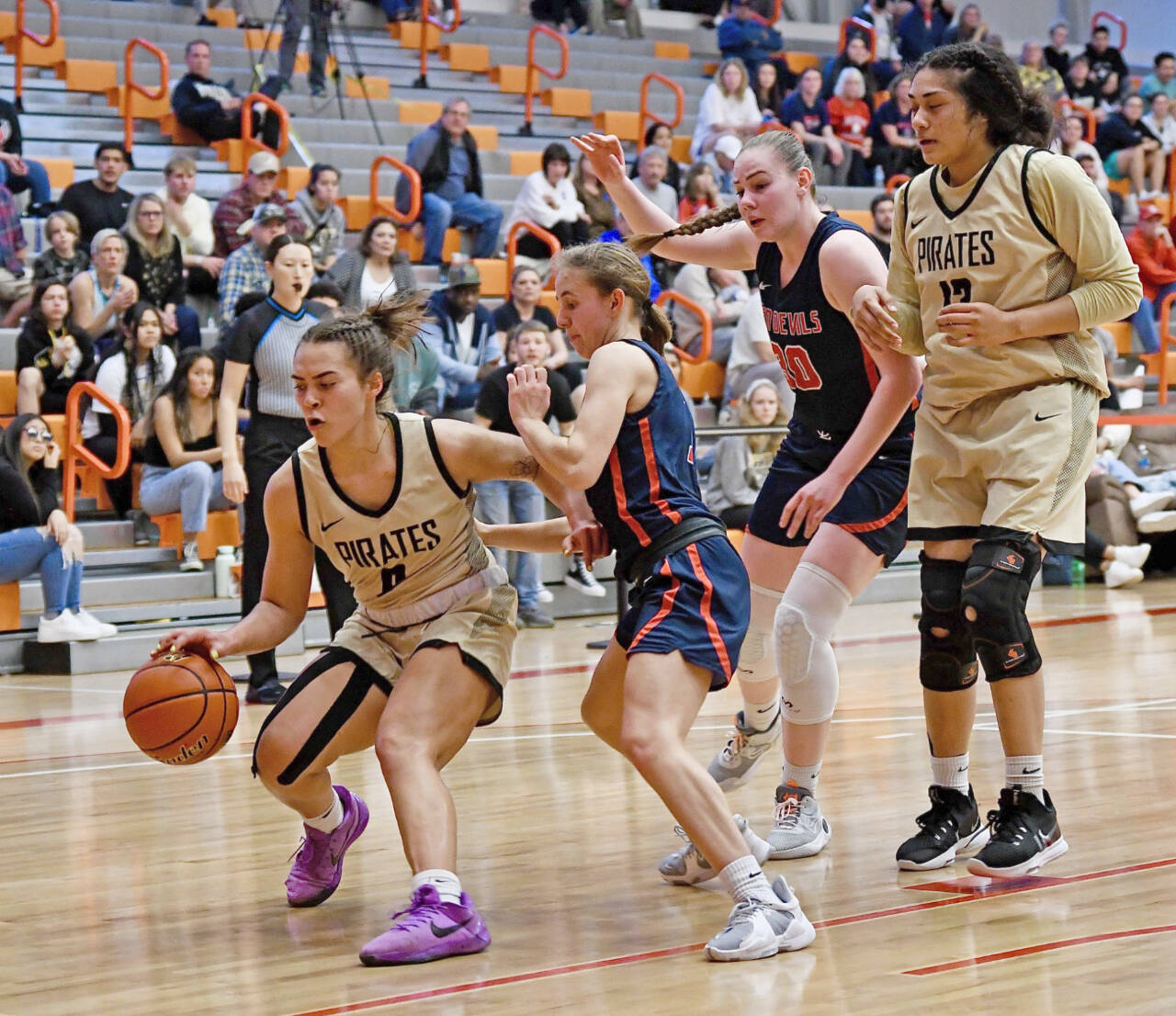 Peninsula College’s Keeli-Jade Smith dribbles against Lower Columbia in the NWAC women’s basketball championship game Sunday. Also in on the play at right is Peninsula’s Itaua Tuisaula. (Jay Cline/Peninsula College Athletics)