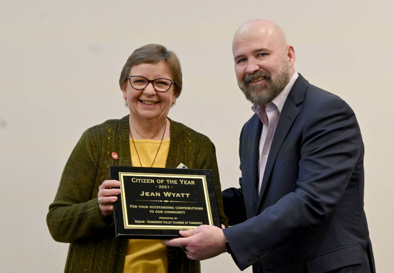 Longtime Sequim Irrigation Festival volunteer Jean Wyatt receives the 2021 Sequim Citizen of the Year honor from Terry Ward, publisher of the Peninsula Daily News and Sequim Gazette, on Tuesday at 7 Cedars Resort. (Michael Dashiell/Olympic Peninsula News Group)