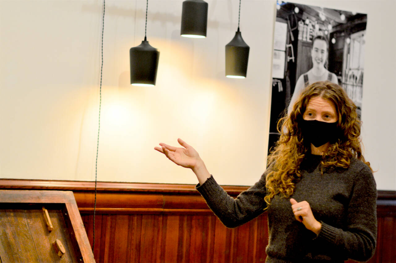 Shelly Leavens, executive director of the Jefferson County Historical Society, will welcome visitors to the new “Wood” exhibition — which includes Annalise Rubida’s wooden lights — during an open house this Saturday evening. The Jefferson Museum of Art & History on Water Street in Port Townsend is the venue. (Diane Urbani de la Paz/Peninsula Daily News)