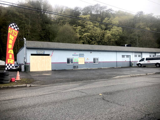 A building stands boarded up Monday along West Marine Drive following a seven-hour standoff Sunday in Port Angeles. (Keith Thorpe/Peninsula Daily News)