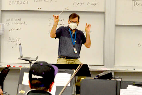Orchestra teacher Daniel Ferland works with his students at Port Townsend High School. About 75 musicians recently traveled to the Central Washington University Orchestra Festival in Ellensburg. (Diane Urbani de la Paz/Peninsula Daily News)