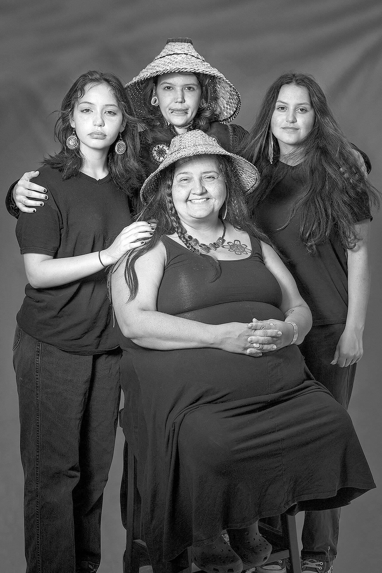 Clockwise from left are Eve, Tigerlily, Lea and Naiome Krienke, whose image is part of “Still Here: Portraits of the Chemakum,” a large-scale exhibit at Chimacum School. The public opening will be held Thursday afternoon. (Photo copyright Brian Goodman)