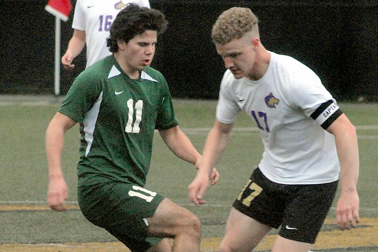 Keith Thorpe/Peninsula Daily News
Port Angeles' Xander Maestas, left, and Sequim's Aidan Henninger face off for ball control as Sequim's Harrison Bell looks on during Tuesday's match at Peninsula College in Port Angeles.