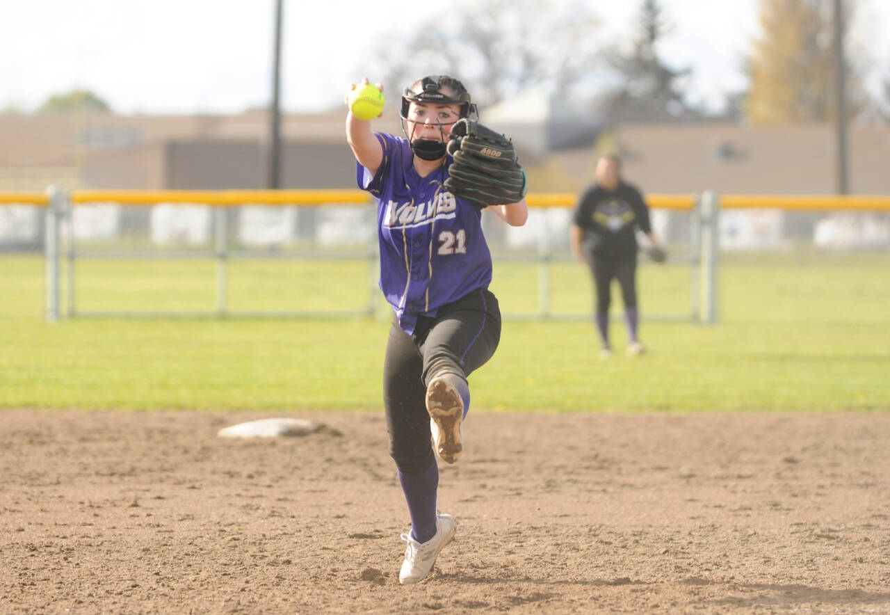 Sequim’s Hannah Bates delivers a pitch against Bremerton on Tuesday. Bates pitched a complete-game two-hitter and had three hits, including a triple, for the Wolves. (Michael Dashiell/Olympic Peninsula News Group)