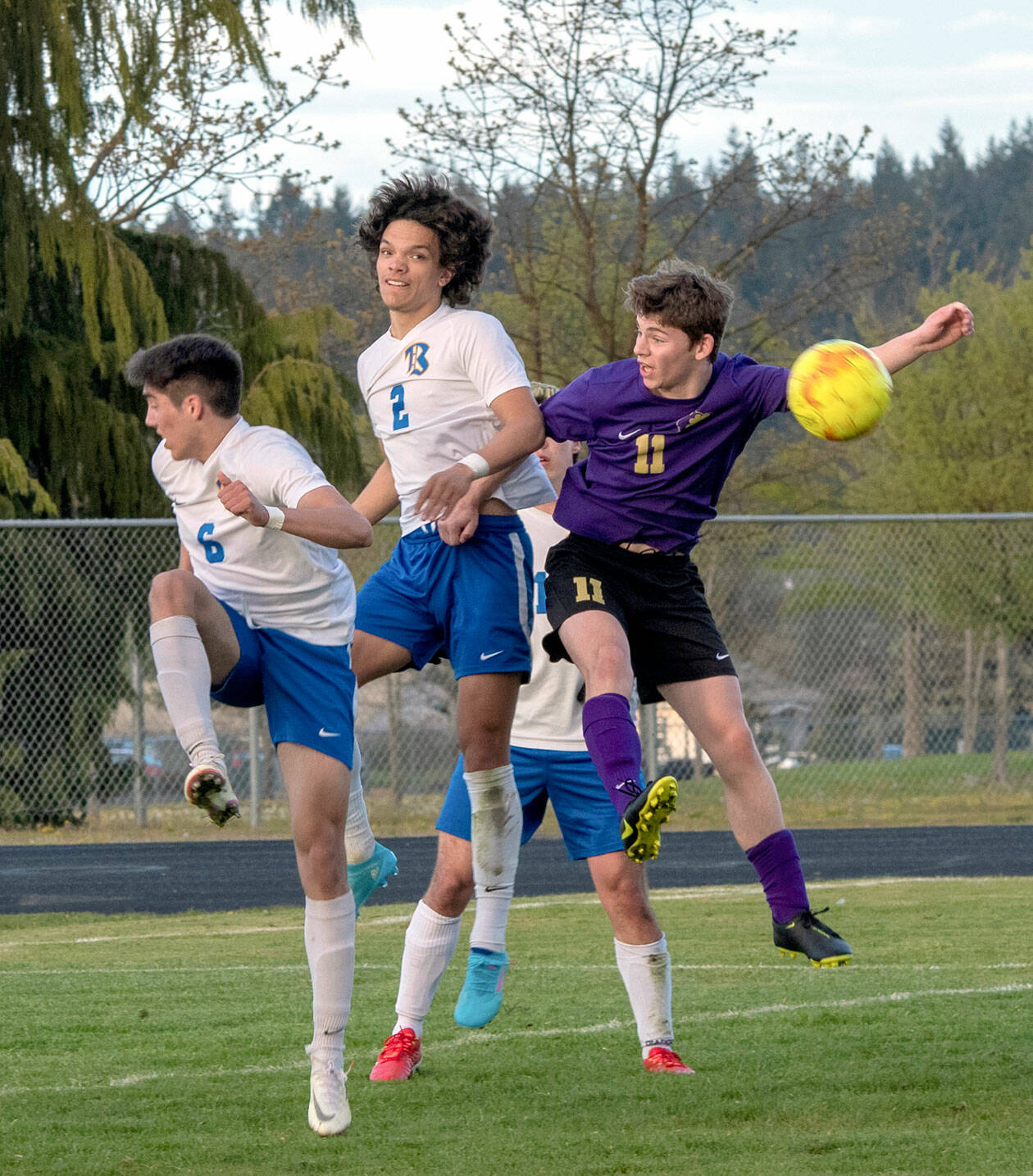 As Knights Aidan Harvey (2) and Diego Clemen (6) defend, Sequim’s Ethan Knight goes up for a header in the Wolves’ April 26 home league game against Bremerton. Bremerton won the match 3-1. (Emily Matthiessen/Olympic Peninsula News Group)