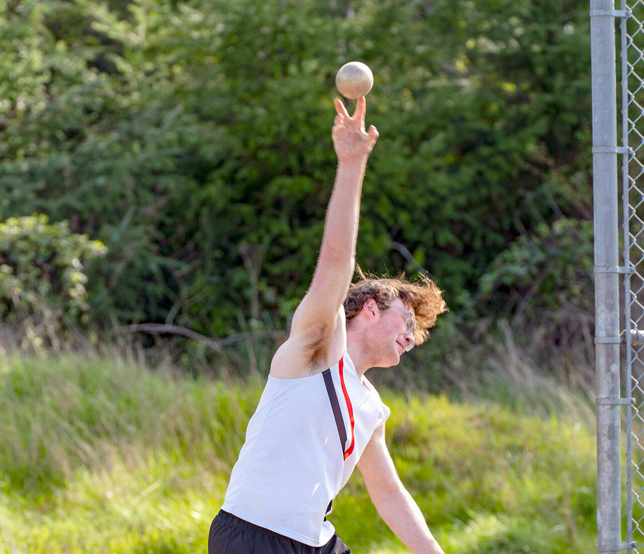 East Jefferson senior Tusker Behernfeld puts the shot a person-record 41 feet, 1/4 inch to win the competition during a meet at Blue Heron Middle School on Wednesday. (Steve Mullensky/for Peninsula Daily News)