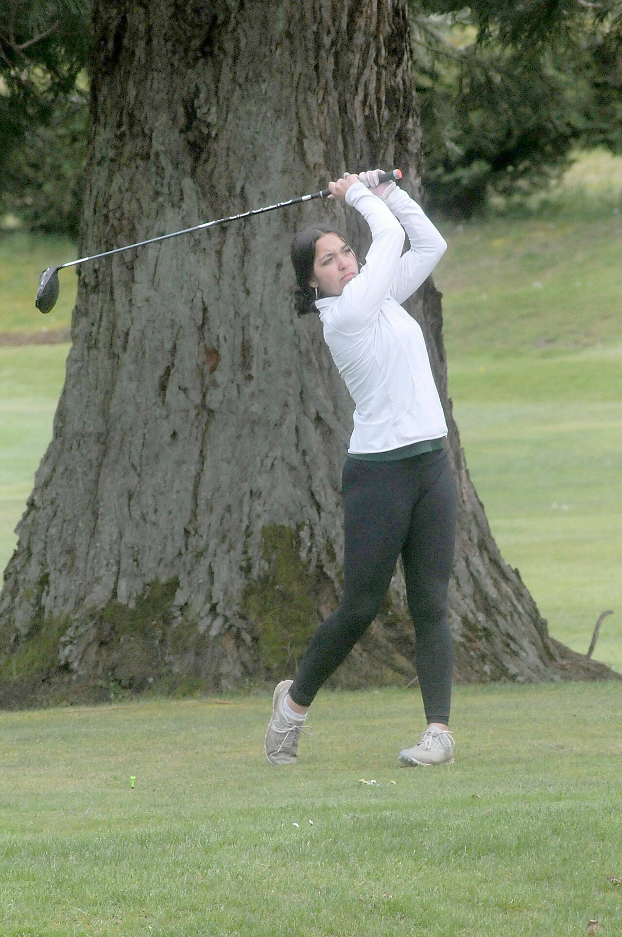 Port Angeles’ Piper Williams tees off on the first hole on Thursday at Peninsula Golf Club in Port Angeles.
Keith Thorpe/Peninsula Daily News