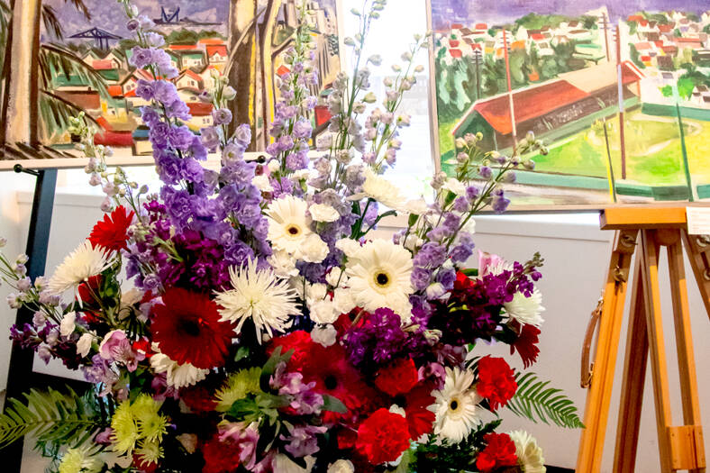 Art in Bloom, a Mother’s Day weekend exhibition at the Port Angeles Fine Arts Center, combines artwork with fresh floral arrangements such as these displayed at the center in 2021. The free exhibition will be open this Saturday and Sunday. (Port Angeles Fine Arts Center)