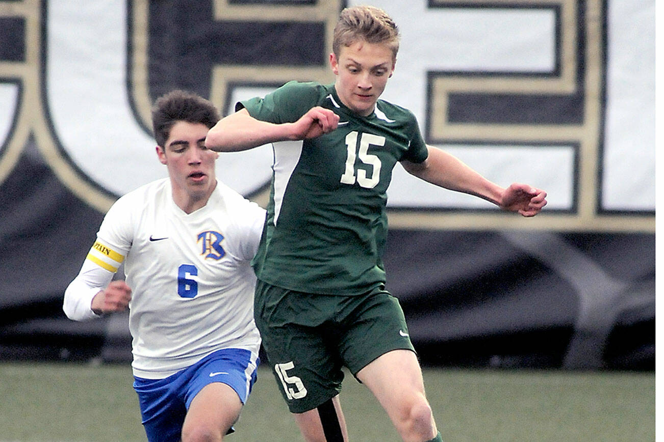 Keith Thorpe/Peninsula Daily News
Port Angeles' Jacob Miller, right, heads off Bremerton's Diego Clemen on Tuesday night at Peninsula College in Port Angeles.