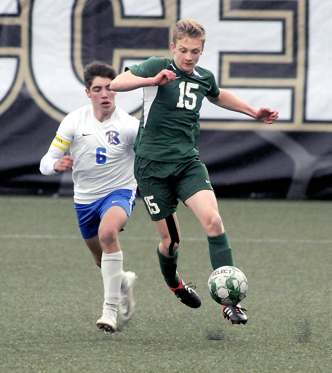 Keith Thorpe/Peninsula Daily News Port Angeles’ Jacob Miller, right, heads off Bremerton’s Diego Clemen on Tuesday night at Peninsula College in Port Angeles.