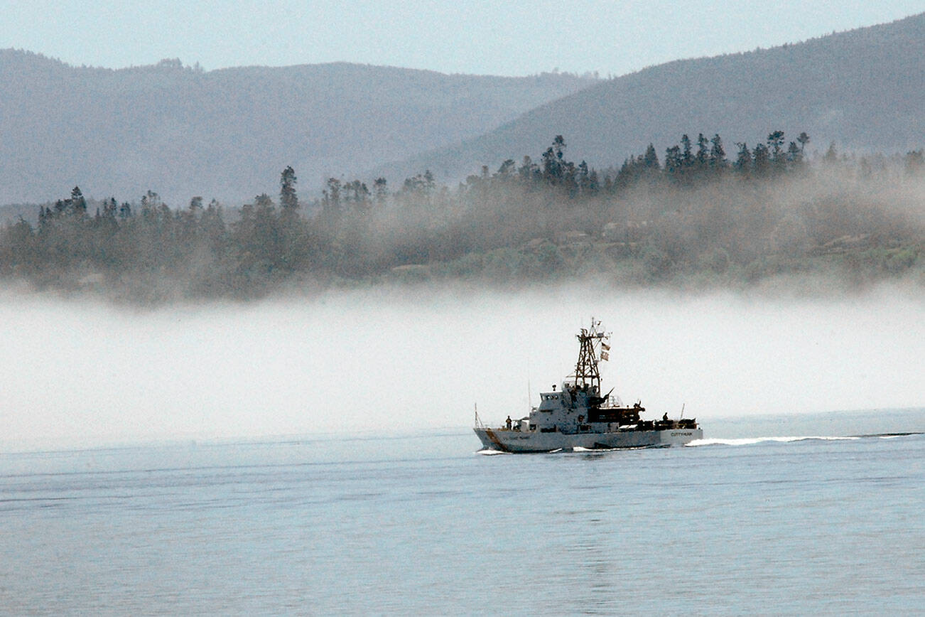 Keith Thorpe/Peninsula Daily News
The U.S, Coast Guard cutter Cuttyhunk sails across Port Angeles Harbor against a backdrop of fog hugging the shoreline. in June 2020.