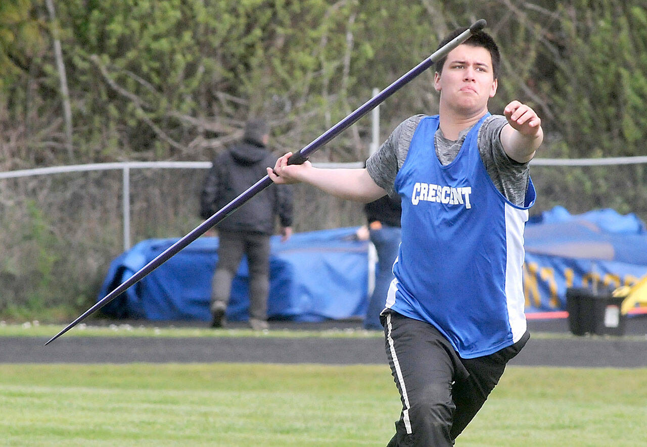 Titus White of Crescent makes his run up in the javelin competition during Friday’s North Olympic League championships at Crescent School in Joyce. (Keith Thorpe/Peninsula Daily News)