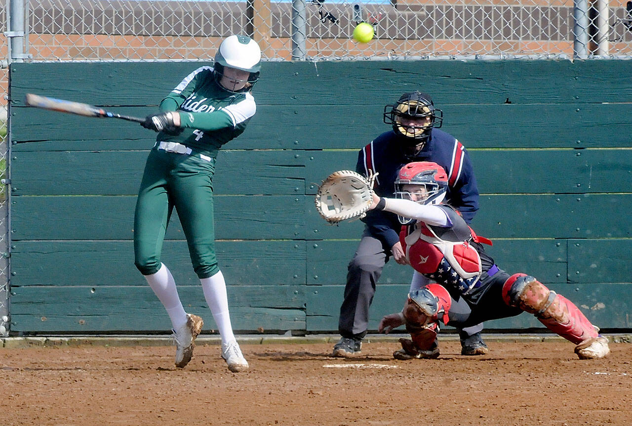 Port Angeles’ Teagan Clark bats in the fourth inning as North Kitsap catcher Mackenzie Phillips waits for the delivery on Thursday at the Dry Creek Athletic Fields in Port Angeles.
Keith Thorpe/Peninsula Daily News