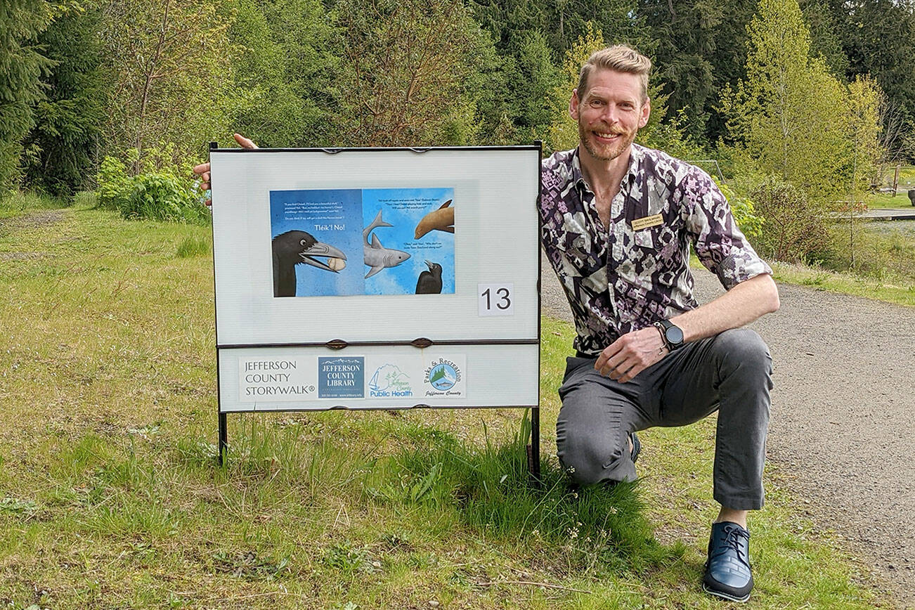 Jefferson County children's librarian Scott Bahlmann placed new stories at H.J. Carroll Park in Chimacum