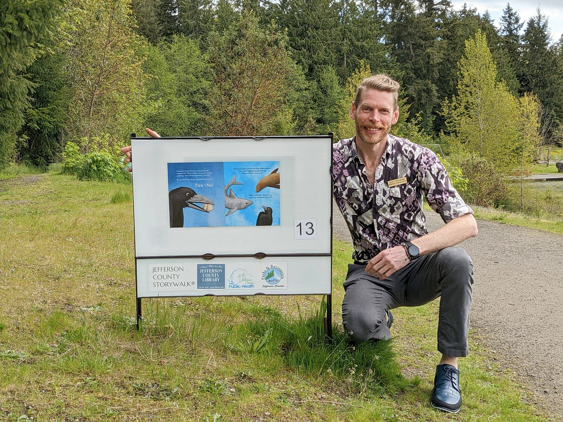 Jefferson County children’s librarian Scott Bahlmann placed new stories at H.J. Carroll Park in Chimacum