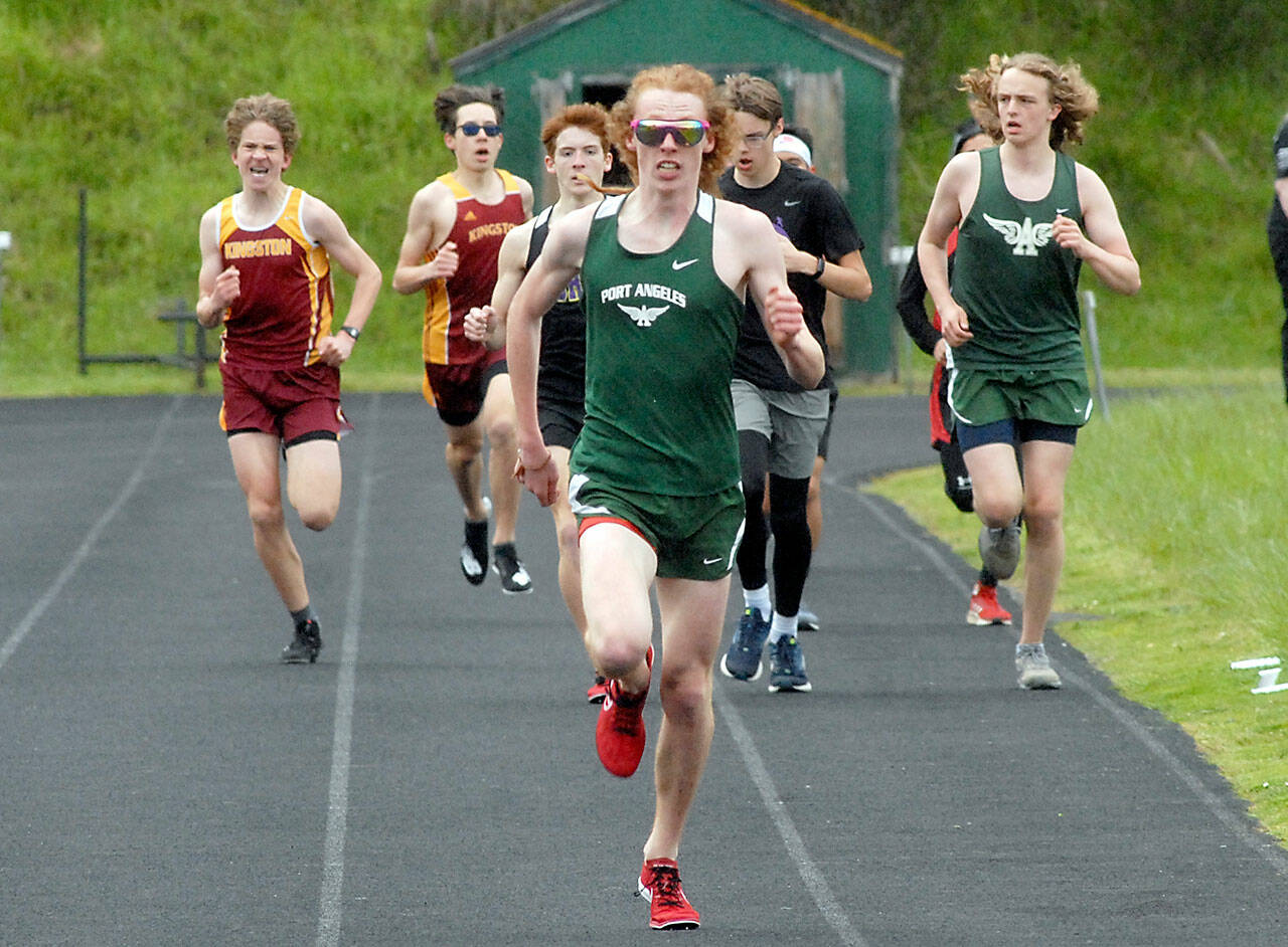 Port Angeles’ Jack Gladfelter pulls away from the pack to win the boys 1600m race on Thursday at Port Angeles High School. (Keith Thorpe/Peninsula Daily News)