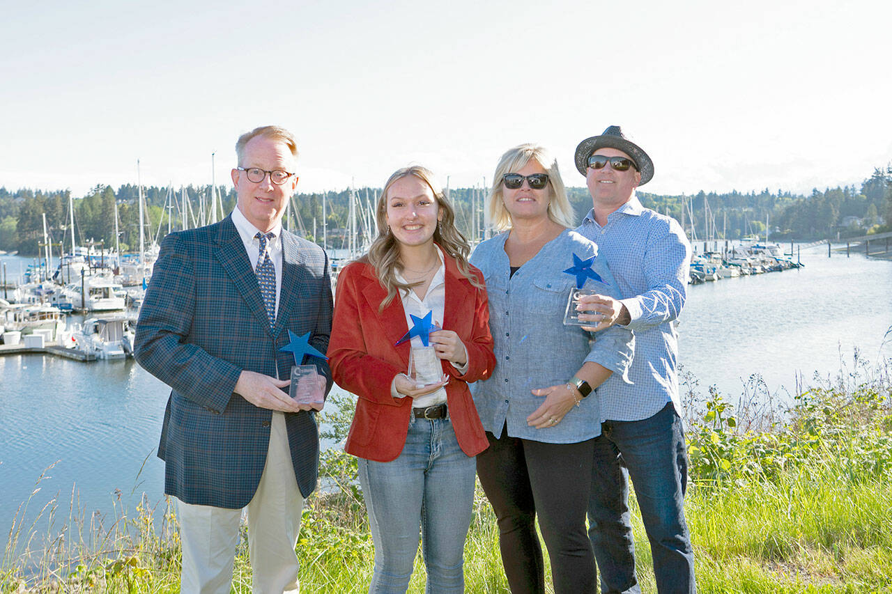 Holding their Leadership trophies presented to them in an awards program Saturday at the Port Ludlow Marina are, from left, Rob Birman, executive director of Centrum, Business Leader of the Year; Akira Anderson, Future Business Leader of the Year; and Wendy and Brent Davis, owners of Lila’s Kitchen, Rising Entrepreneur of the year. Two other winners who were unable to attend are Ariel Speser, Citizen of the Year, and Dr. Allison Berry, Young Professional of the Year. (Steve Mullensky/for Peninsula Daily News)