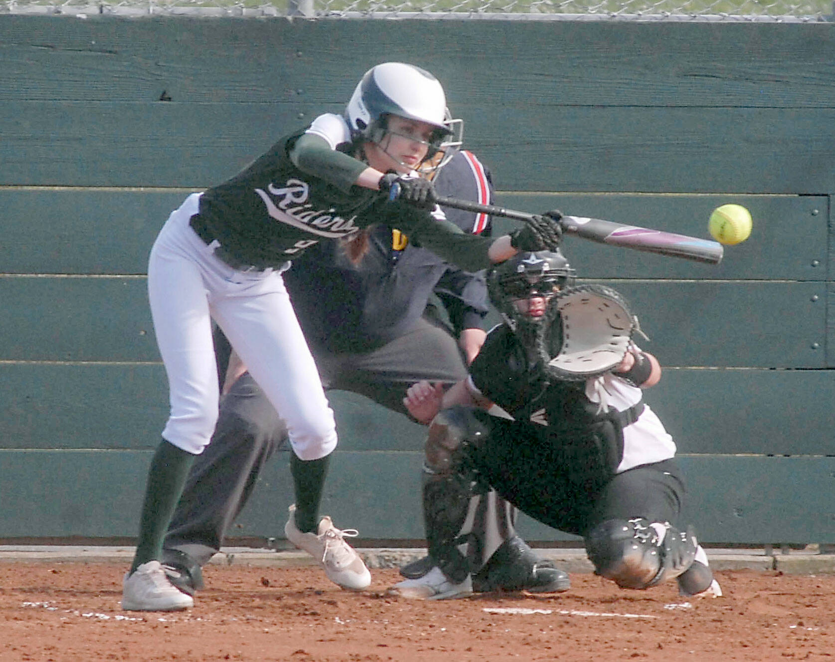 Port Angeles’ Emi Halberg bats in an April game against Kingston at Dry Creek School in Port Angeles. (Keith Thorpe/Peninsula Daily News)