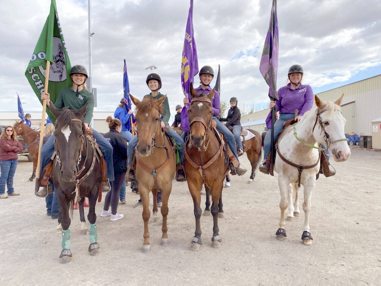 High school equestrians Maggie Anderson, left, Sydney Hutton, Libby Swanberg and Joanna Seelye prepare to enter the arena for the Grand Entry at Washington High School Equestrian Team (WAHSET) State Finals. (Courtesy photo)
