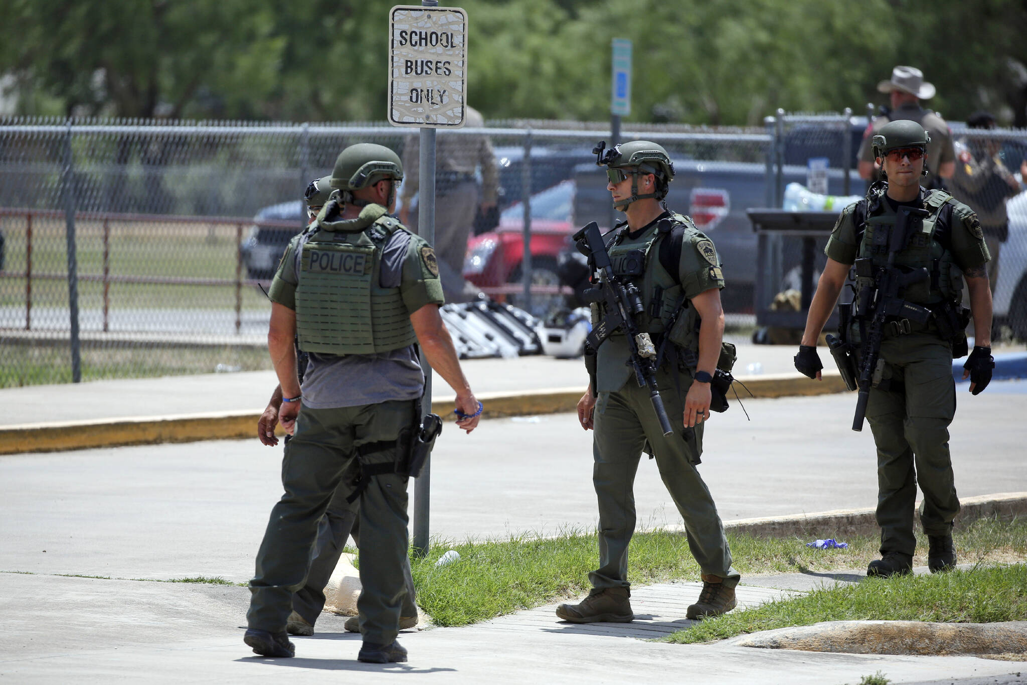 Law enforcement personnel stand outside Robb Elementary School following a shooting Tuesday in Uvalde, Texas. (AP Photo/Dario Lopez-Mills)
