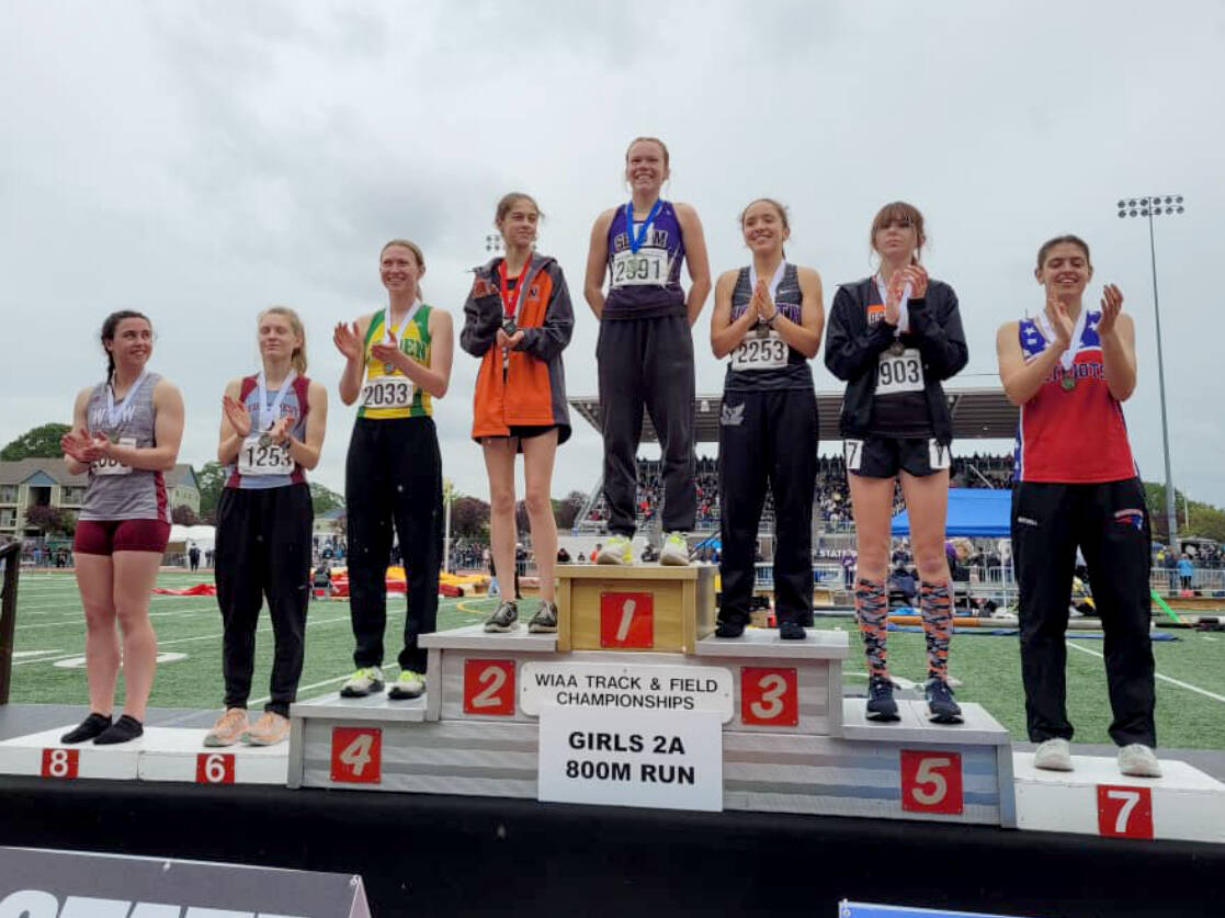 Sequim's Riley Pyeatt receives her medal for winning the state championship in the 800-meter run Saturday at the 2A state track and field championships held at Mount Tahoma Stadium. (Michael Dashiell/Olympic Peninsula News Group)