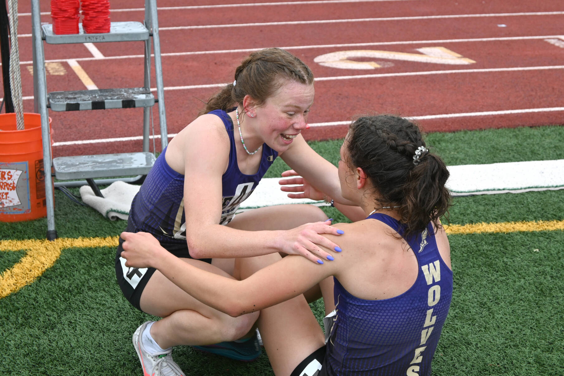 Sequim’s Riley Pyeatt, left, and Eve Mavy celebrate winning the girls 4x400 state championship Saturday at Mount Tahoma Stadium in Tacoma. (Michael Dashiell/Olympic Peninsula News Group)