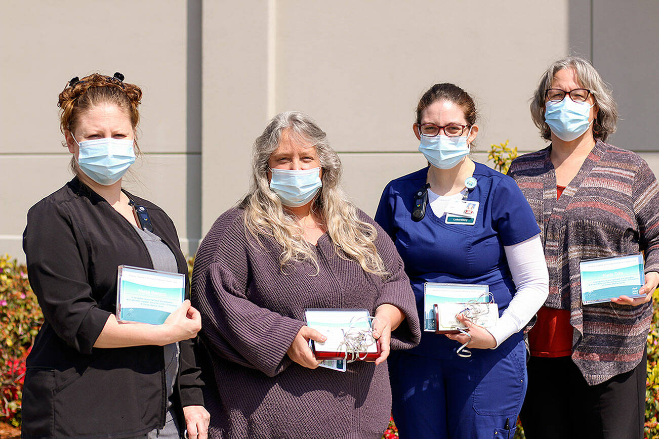 Lab assistants Nettie Benson, left, Sandra Watne, Jamie Burrow and Karla Dills were recently honored at Olympic Medical Center.