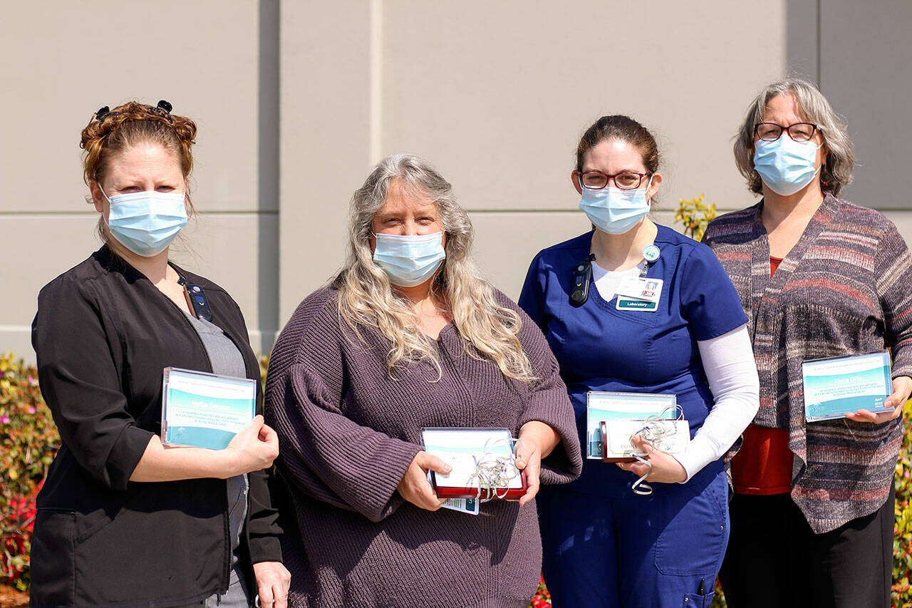 Lab assistants Nettie Benson, left, Sandra Watne, Jamie Burrow and Karla Dills were recently honored at Olympic Medical Center.