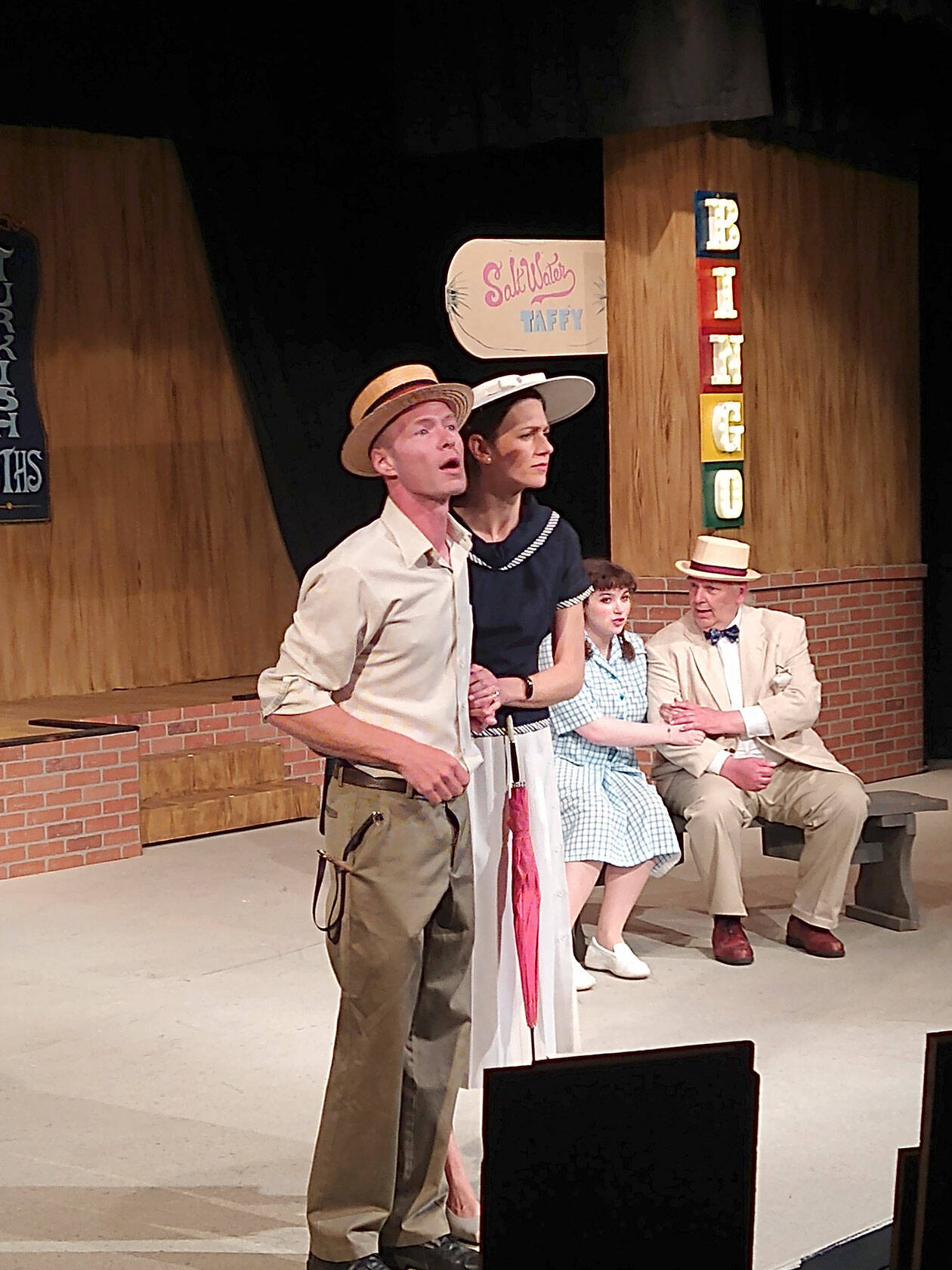 Henry Antrobus (Gabe Mills) helps his mom (Deanna Eikhoff) look for whales in Atlantic City, while his sister, Gladys (Juliette Burnette) tells her dad (Mark Valentine) how deep the ocean is.