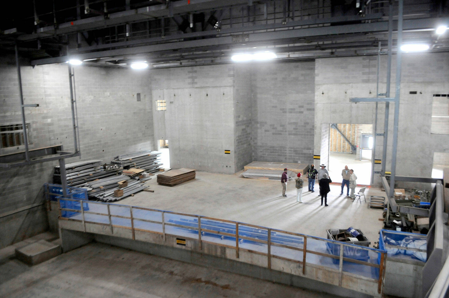 Visitors gather on the stage of the auditorium during Thursday’s open house at the Field Arts & Events Hall. (Keith Thorpe/Peninsula Daily News)