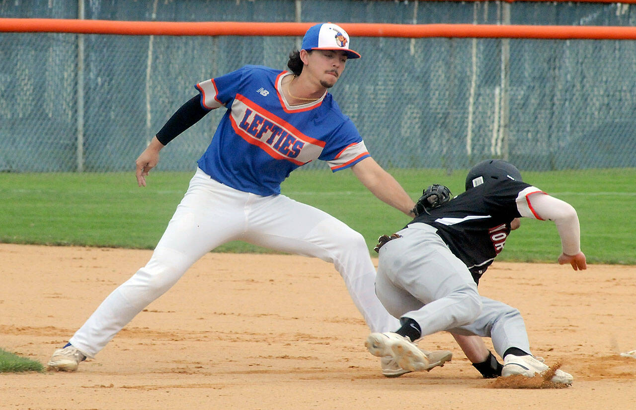 Lefties shortstop Riley Parker tags out Kamloops baserunner Tommy Green during a steal attempt in the second inning of the first game of Saturday’s double header in Port Angeles. (Keith Thorpe/Peninsula Daily News)