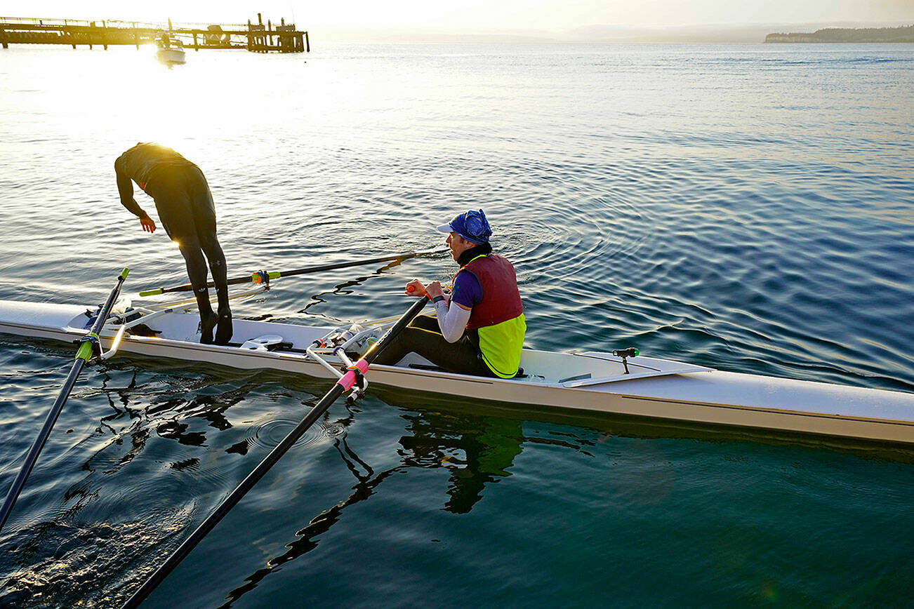 Thiago Silva of Team IMUA cools off with a dive into Port Townsend Bay after 70 hard rowing miles with teammate Greg Spooner to win the 2019 Seventy48 human-powered watercraft race. The 2022 Seventy48 race will begin at 7 p.m. Friday in Tacoma, 70 miles from Port Townsend, and participants must ring the bell at City Dock in Port Townsend within 48 hours. The Northwest Maritime Center plans an awards ceremony at Sunday’s Ruckus, which precedes the start of the Race to Alaska on Monday. Some 130 teams were signed up as of Wednesday. (Steve Mullensky/for Peninsula Daily News)