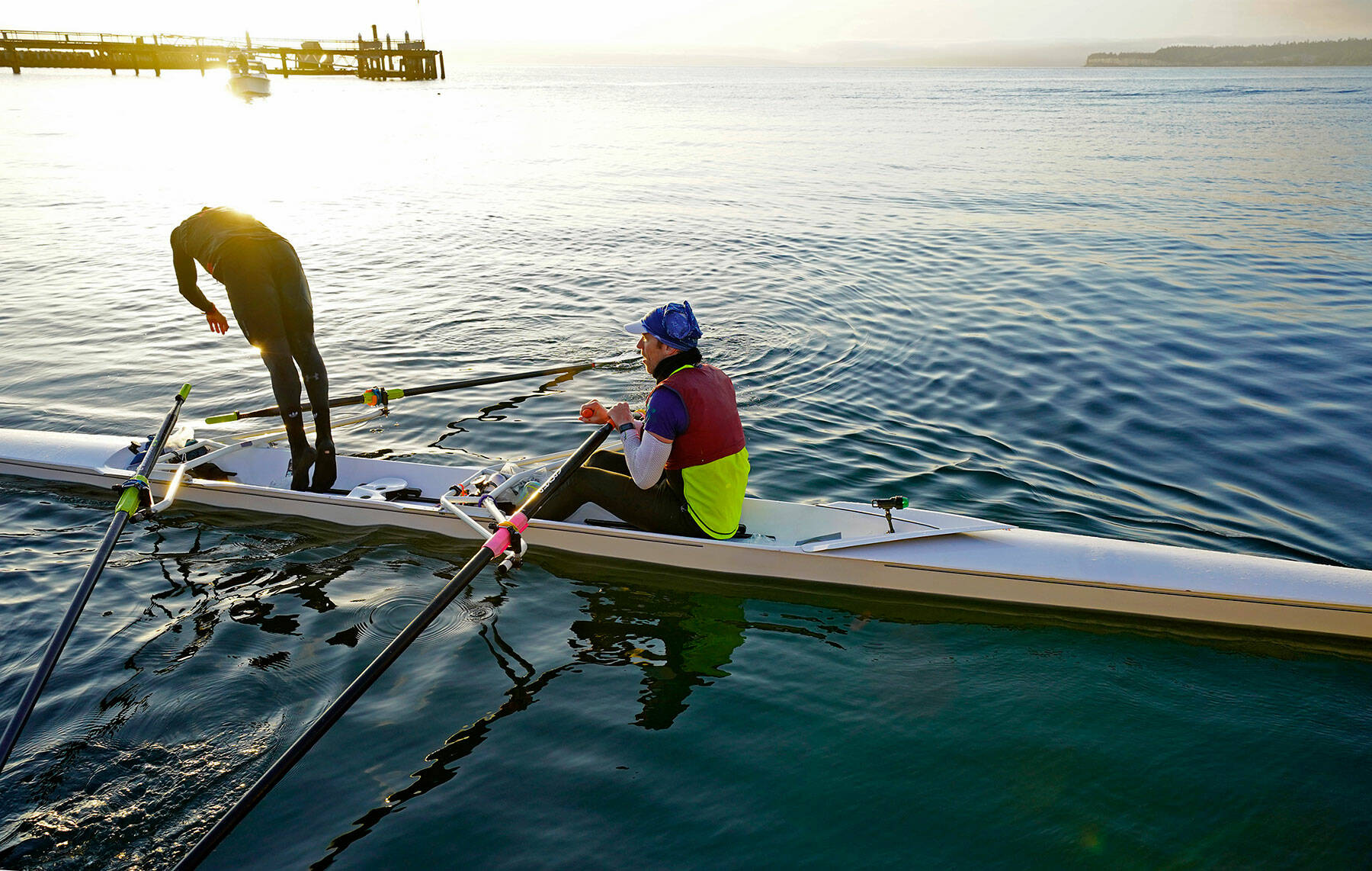 Thiago Silva of Team IMUA cools off with a dive into Port Townsend Bay after 70 hard rowing miles with teammate Greg Spooner to win the 2019 Seventy48 human-powered watercraft race. The 2022 Seventy48 race will begin at 7 p.m. Friday in Tacoma, 70 miles from Port Townsend, and participants must ring the bell at City Dock in Port Townsend within 48 hours. The Northwest Maritime Center plans an awards ceremony at Sunday’s Ruckus, which precedes the start of the Race to Alaska on Monday. Some 130 teams were signed up as of Wednesday. (Steve Mullensky/for Peninsula Daily News)