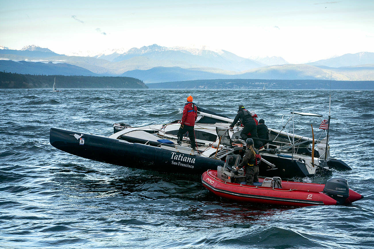 Four competitors in the first stage of the Race to Alaska were rescued Monday by the U.S. Coast Guard and a support vessel when their boats became disabled in 10-foot-high waves and gale force winds on the Strait of Juan de Fuca. The 750-mile adventure race that begins in Port Townsend and ends in Ketchikan, Alaska, does not allow engines and prohibits drops of food and supplies to competitors. The mast on Team Narwhal’s 32-foot trimaran snapped and the vessel was towed to shore. (Liv von Oelreich)