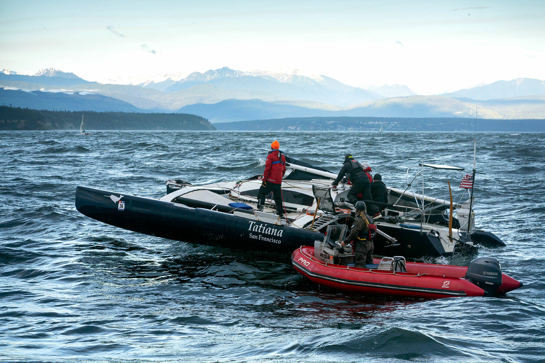 Four competitors in the first stage of the Race to Alaska were rescued Monday by the U.S. Coast Guard and a support vessel when their boats became disabled in 10-foot-high waves and gale force winds on the Strait of Juan de Fuca. The 750-mile adventure race that begins in Port Townsend and ends in Ketchikan, Alaska, does not allow engines and prohibits drops of food and supplies to competitors. The mast on Team Narwhal’s 32-foot trimaran snapped and the vessel was towed to shore. (Liv von Oelreich)