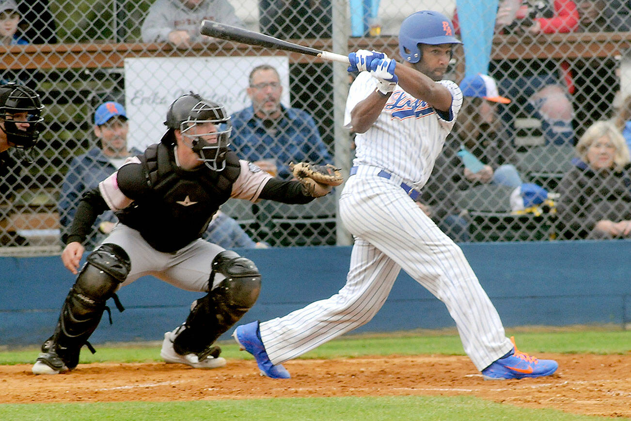 Keith Thorpe/Peninsula Daily News
Lefties' Golden Tate hits into an RBI double as Bend catcher Isah Burk looks on during the first inning on Tuesday evening at Port Angeles Civic Field.