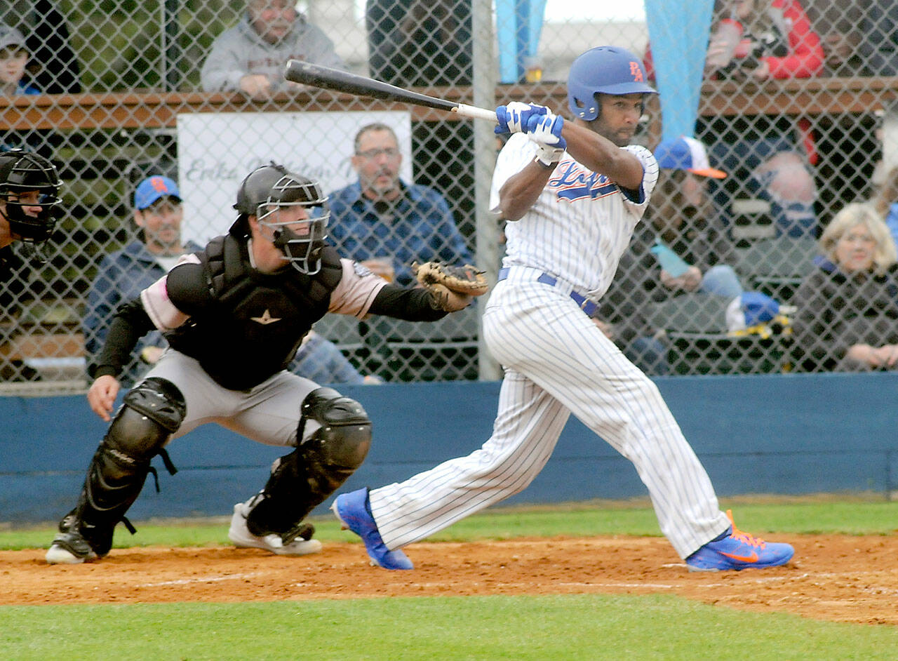 Golden Tate lines an RBI double to right field in his first at-bat as a Lefties player as Bend catcher Isaiah Burke looks on during the first inning on Tuesday evening at Port Angeles Civic Field. (Keith Thorpe/Peninsula Daily News)