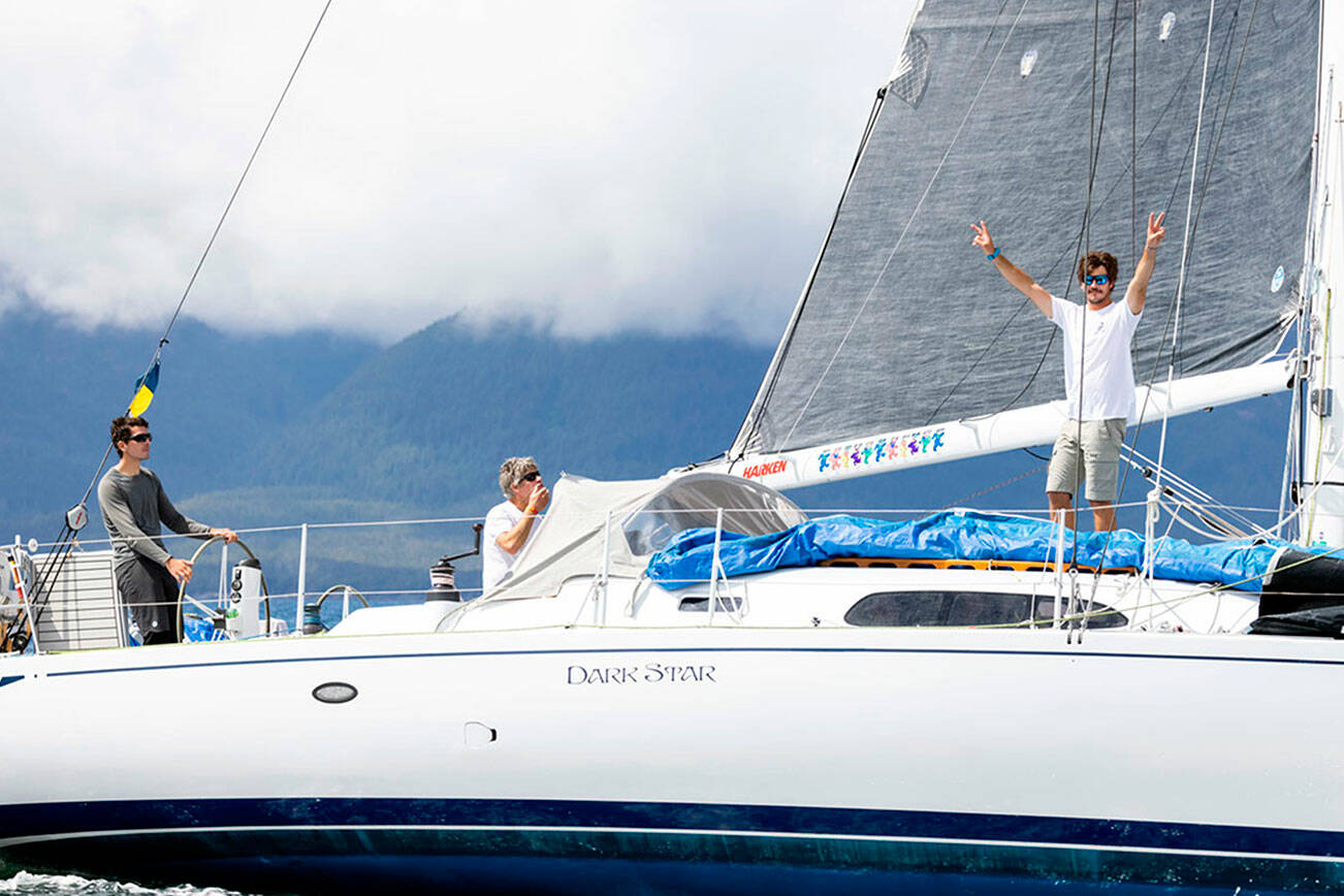 Team Pure and Wild, from left, Alyosha Strum-Palerm, Jonathan McKee and Matt Pistay, sail into Ketchikan’s Thomas Basin harbor Monday to win the 750-mile Race to Alaska. (Thomas Hawthorne)