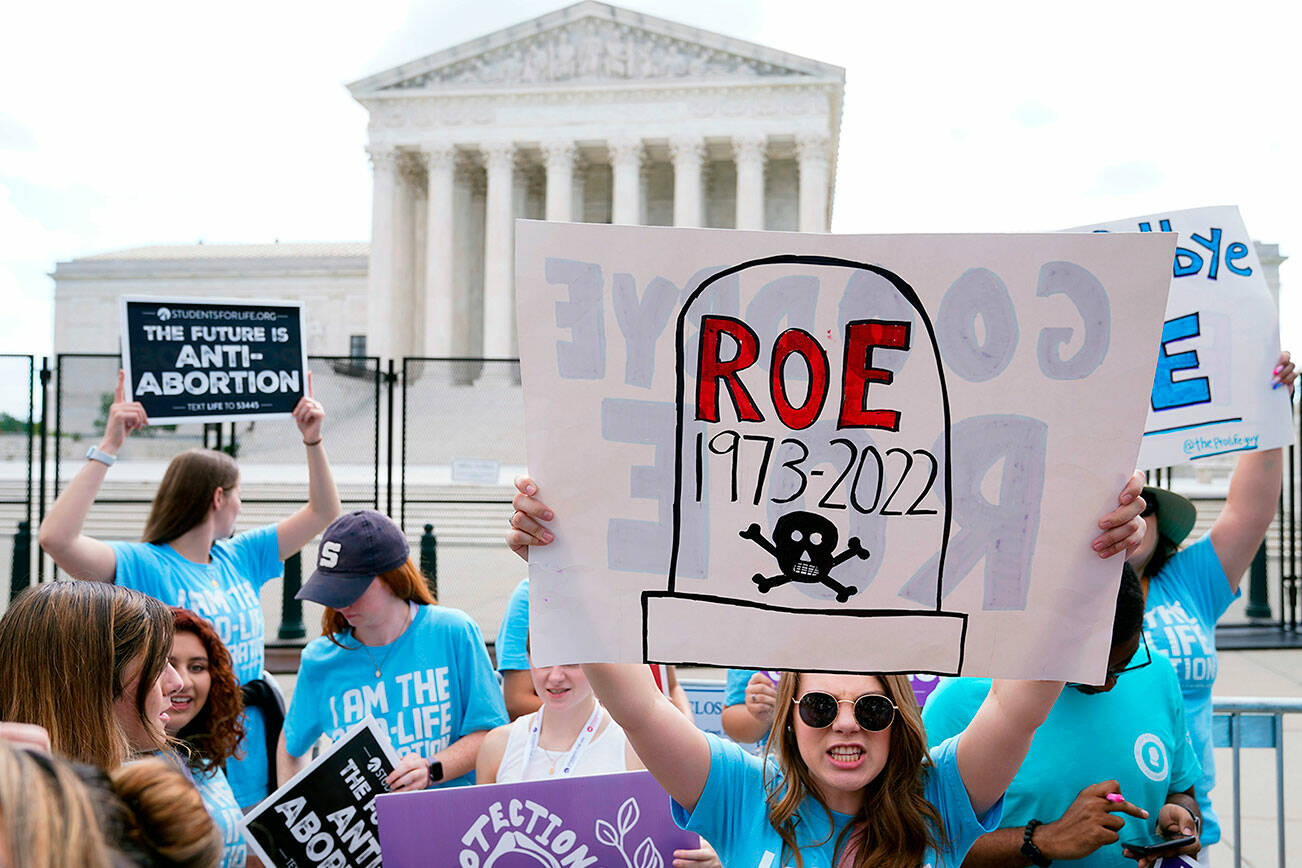 Demonstrators protest about abortion outside the Supreme Court in Washington, Friday, June 24, 2022. (AP Photo/Jacquelyn Martin)