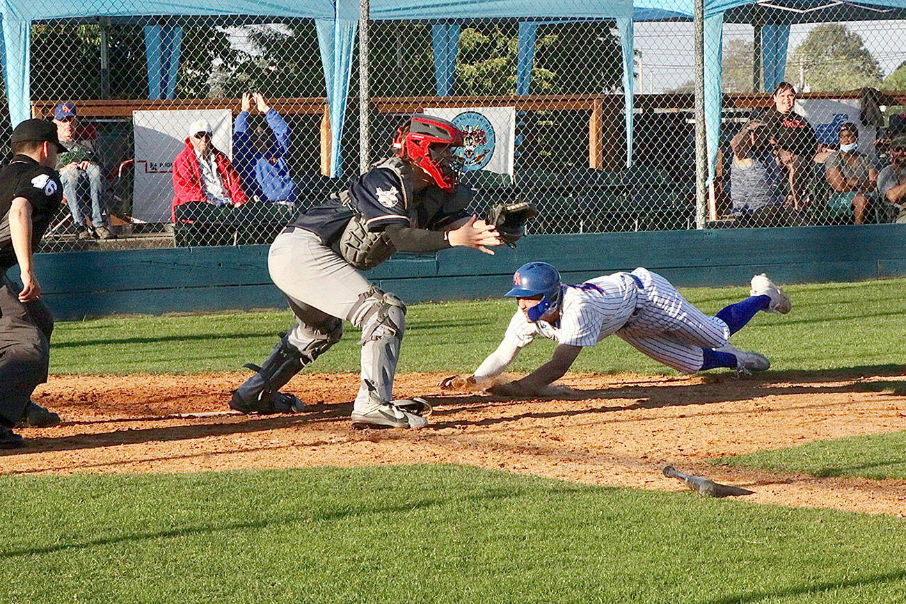 Kayden Beauregard the catcher for the Nanaimo Night Owls is a little late receiving the throw as the Lefties' Riley Parker slides head first into home safely for Port Angeles in the bottom of the fourth inning. (Dave Logan/for Peninsula Daily News)