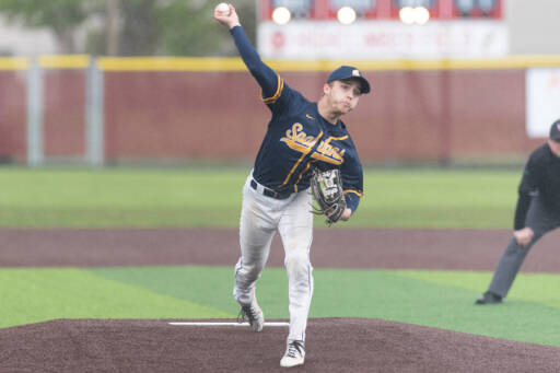 Forks pitcher Logan Olson releases a pitch against Adna in the District 4 quarterfinals at Shelton High School May 7. (Alec Dietz/The Centralia Chronicle)