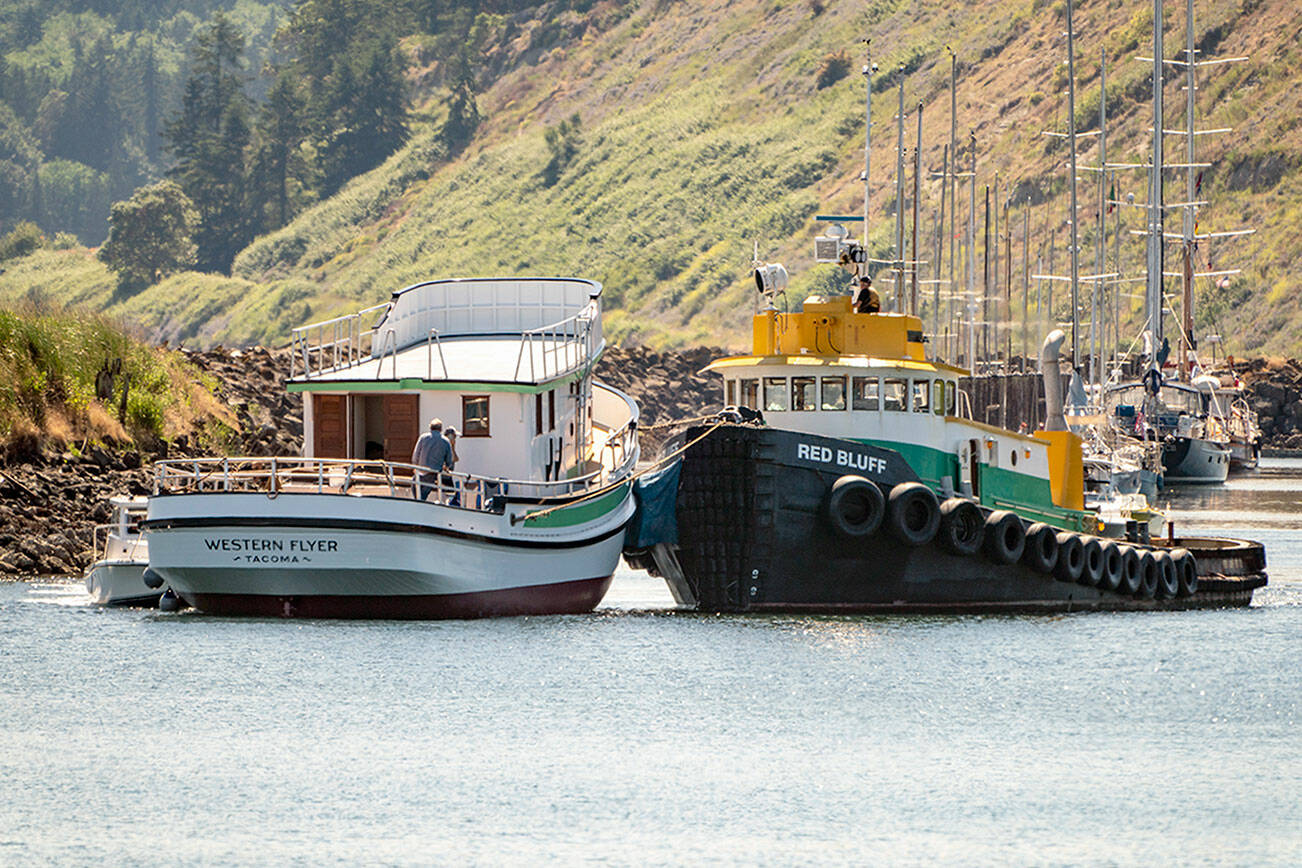Steve Mullensky/for Peninsula Daily News

The tug Red Bluff moves the Western Flyer out of the Port Townsend Boat Haven on Thursday and was towed to Seattle for the installation of an engine and other components.