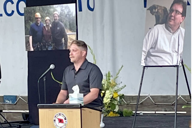 Aaron Whitfeldt remembers his older brother, Ryan Malane, at a celebration of his life on the Port Angeles City Pier on Sunday. More than 100 friends, family and business associates from the U.S. and Canada attended the ceremony for the Black Ball Ferry Line's co-owner and vice president who died June 13 at the age of 48. (Paula Hunt/Peninsula Daily News)