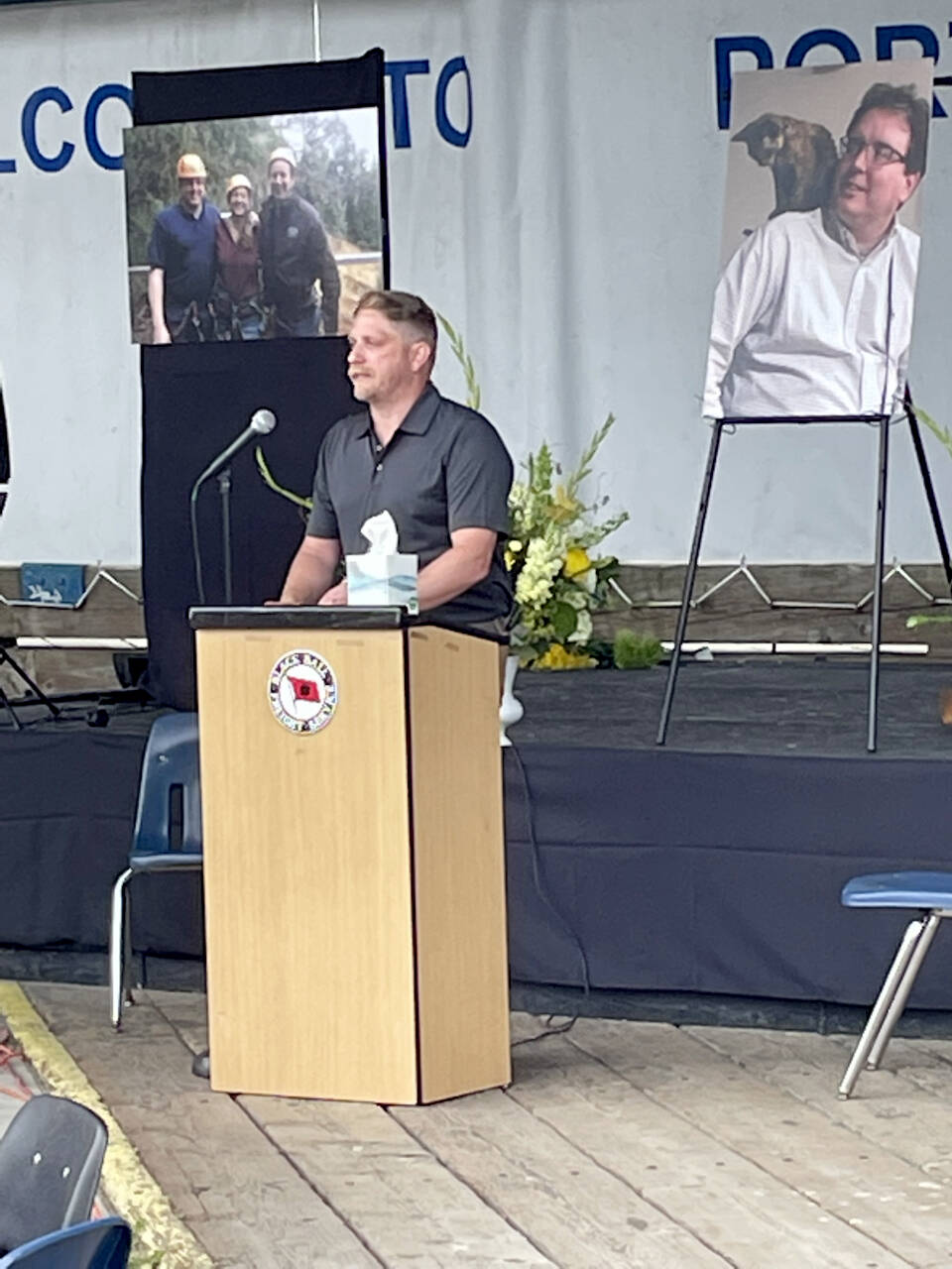 Aaron Whitfeldt remembers his older brother, Ryan Malane, at a celebration of his life on the Port Angeles City Pier on Sunday. More than 100 friends, family and business associates from the U.S. and Canada attended the ceremony for the Black Ball Ferry Line’s co-owner and vice president who died June 13 at the age of 48. (Paula Hunt/Peninsula Daily News)