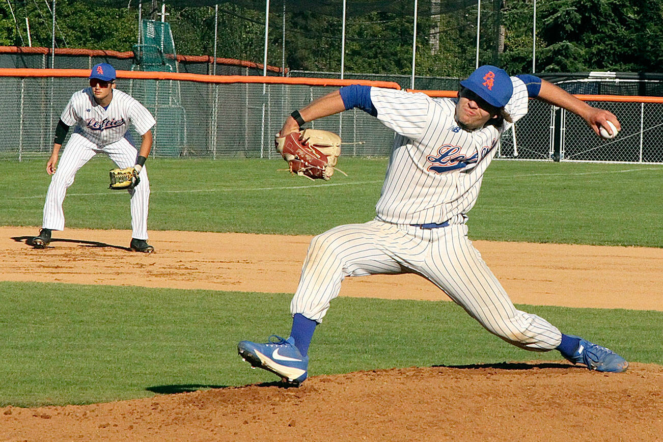 Dillon Dibrell of the PA Lefties fires in a fast pitch to the batter from Kamloops Northpaws. He is backed up by his 3rd baseman B.Y. Choi. dlogan
