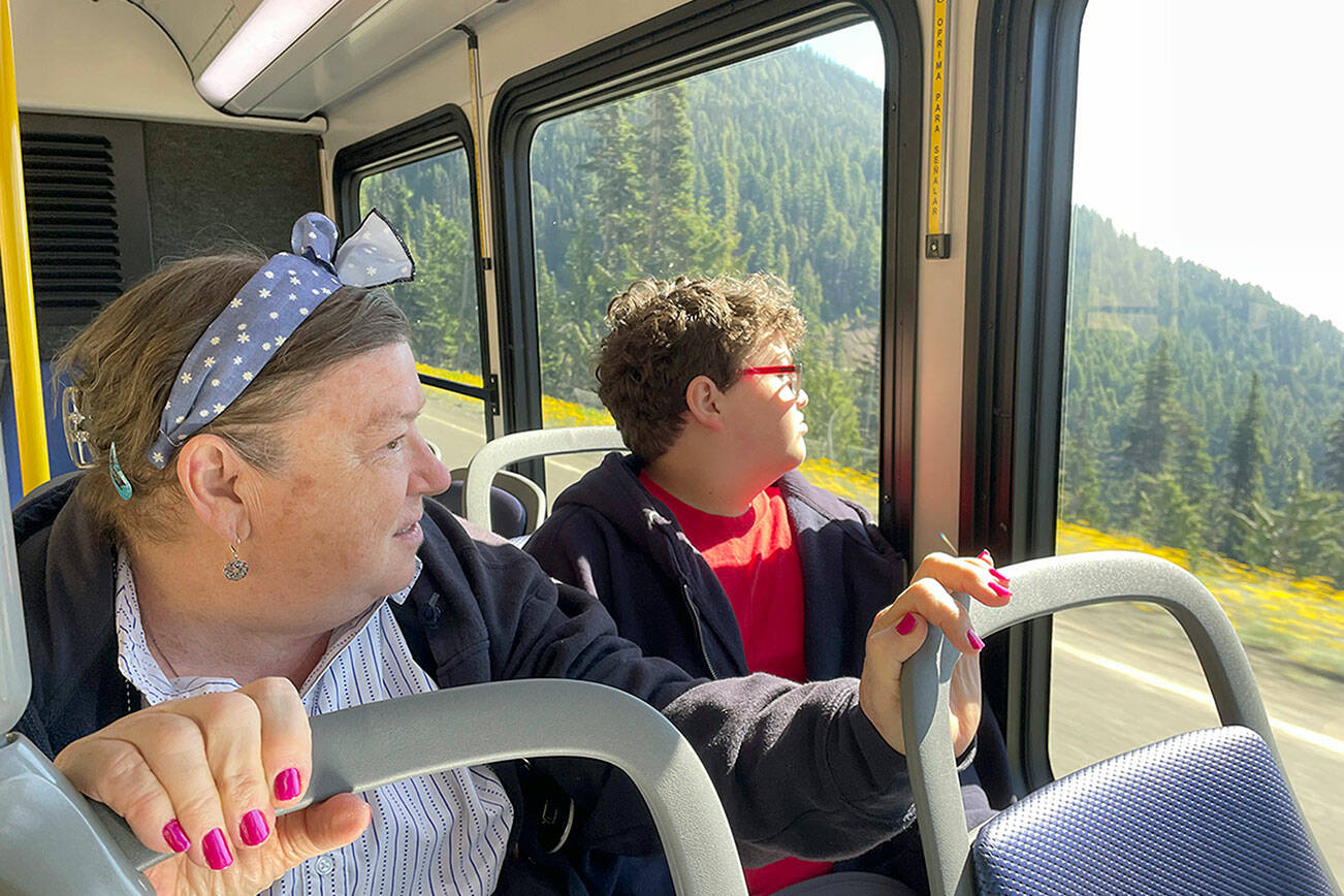Jeannie Thompson, left, of Livonia, Mich., has visited Hurricane Ridge many times over the years, but says she loves the idea of taking the shuttle rather than driving. This was her 14-year-old grandson Sherman Thompson’s first trip to Port Angeles and Hurricane Ridge. (Paula Hunt/Peninsula Daily News)